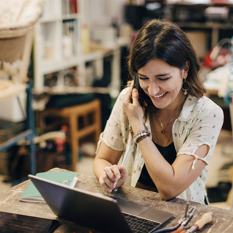 self employer behind a laptop 